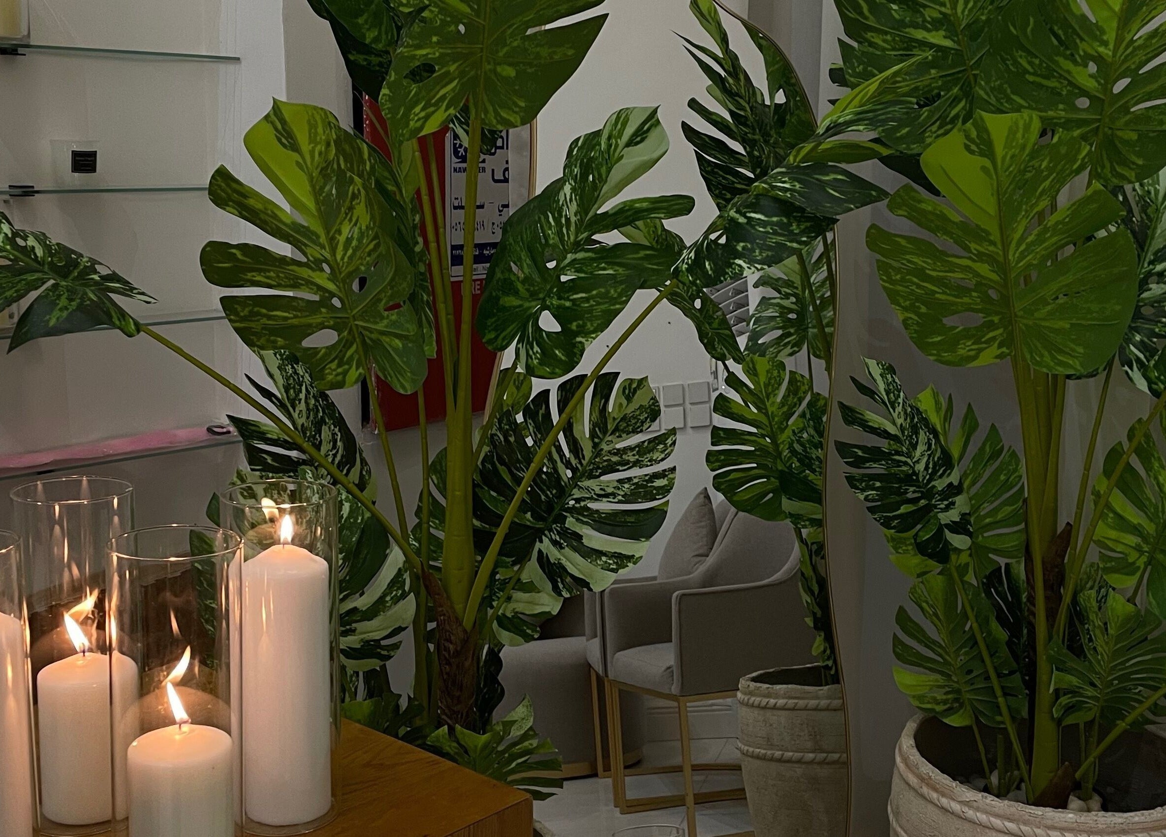 Serene candles and lush greenery create a calming vibe at Luna Noor Salon, Riyadh, Riyadh Province, SA.