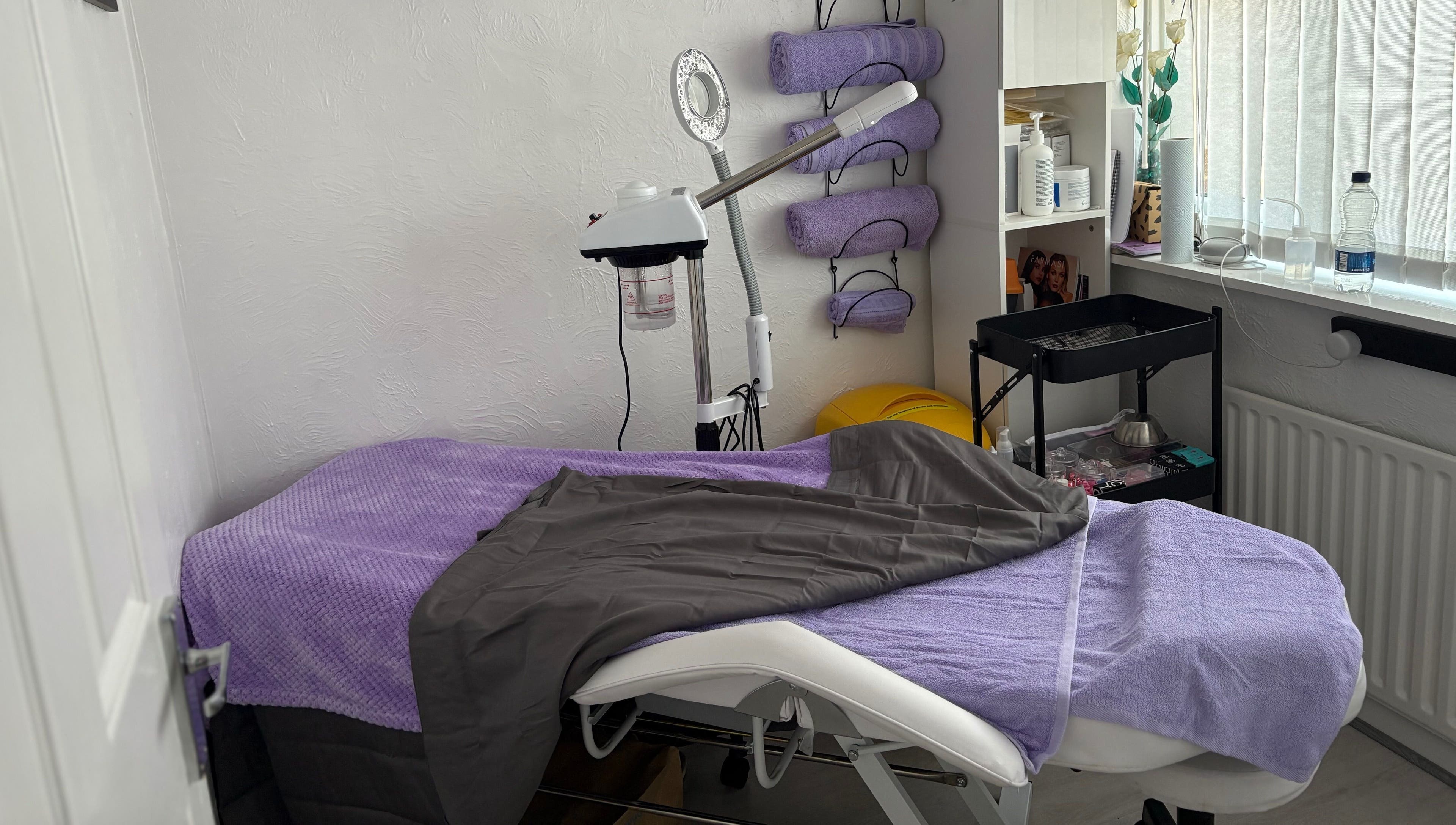 Cozy treatment room at Timeless Beauty by Mel, Gravesend, England, GB with relaxing purple decor.