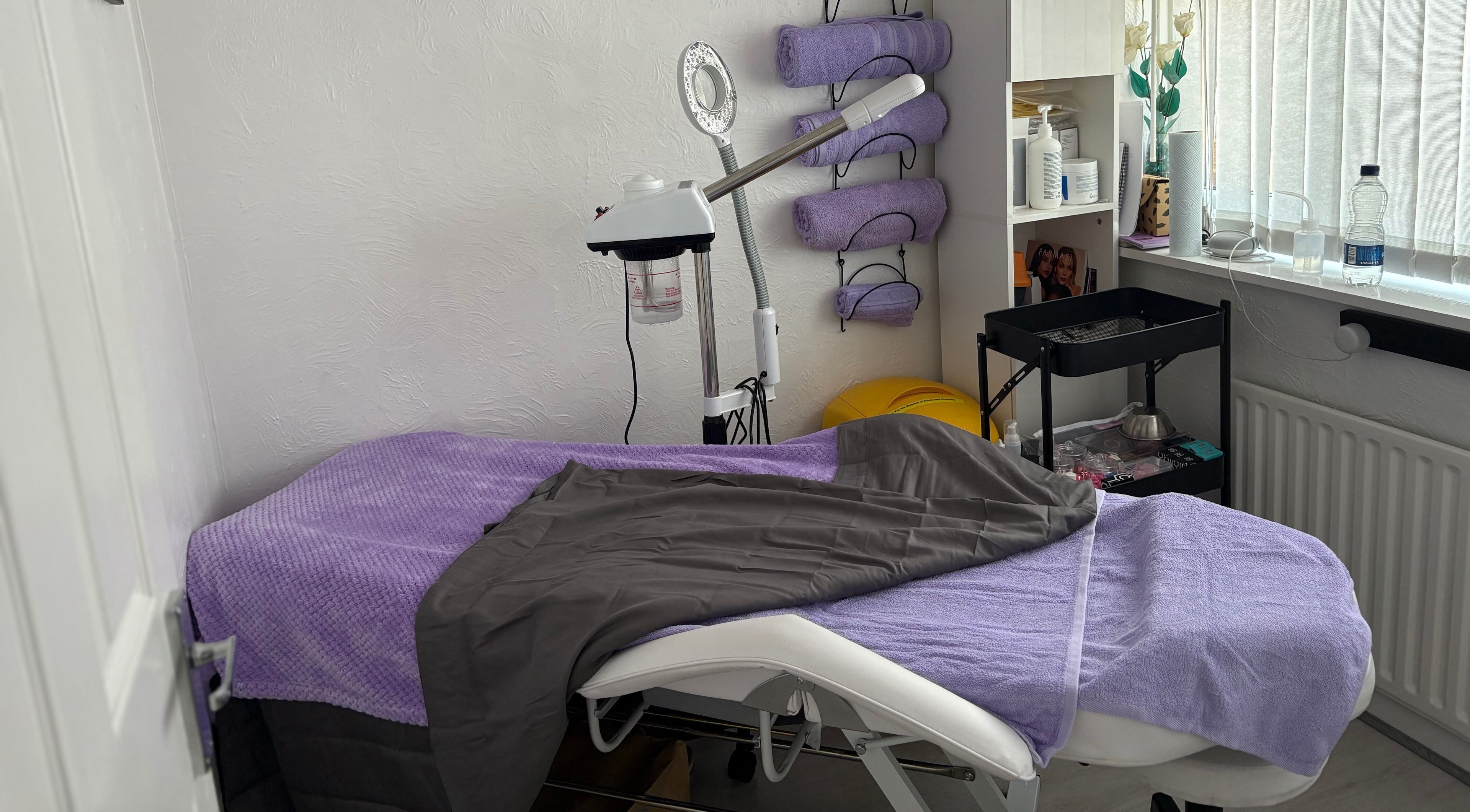 Cozy treatment room at Timeless Beauty by Mel, Gravesend, England, GB with relaxing purple decor.