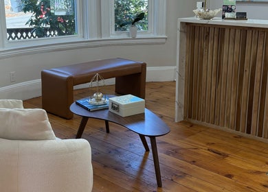 Cozy seating at Sandra Faria Beauty, Hudson, Massachusetts, with natural light and elegant decor.