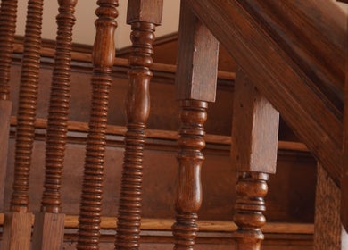 Intricate wooden banister at Sandra Faria Beauty in Hudson, Massachusetts, US, exuding classic elegance.