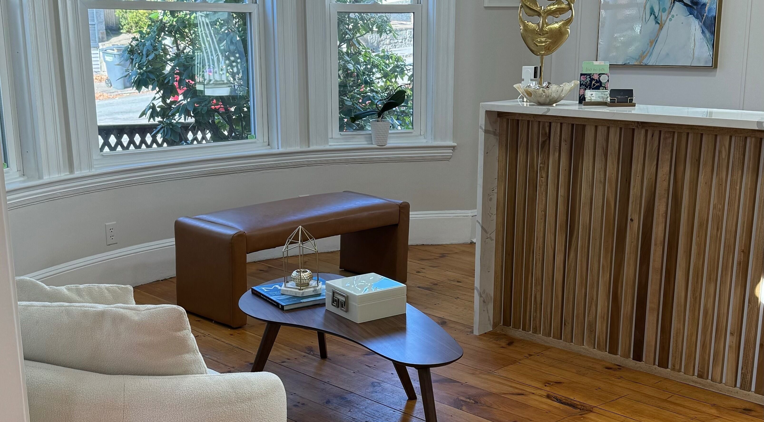 Cozy seating area at Sandra Faria Beauty, Hudson, Massachusetts, US with elegant wooden fixtures.
