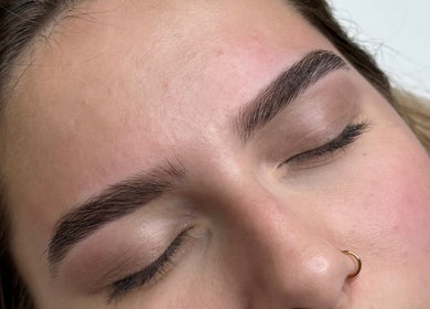 Close-up of expertly shaped eyebrows at Sandra Faria Beauty in Hudson, Massachusetts, US.