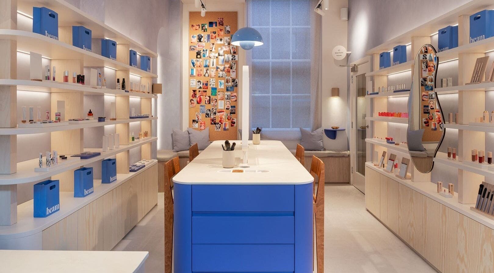 Modern interior of Beam in London, England, GB featuring sleek shelves and vibrant beauty displays.