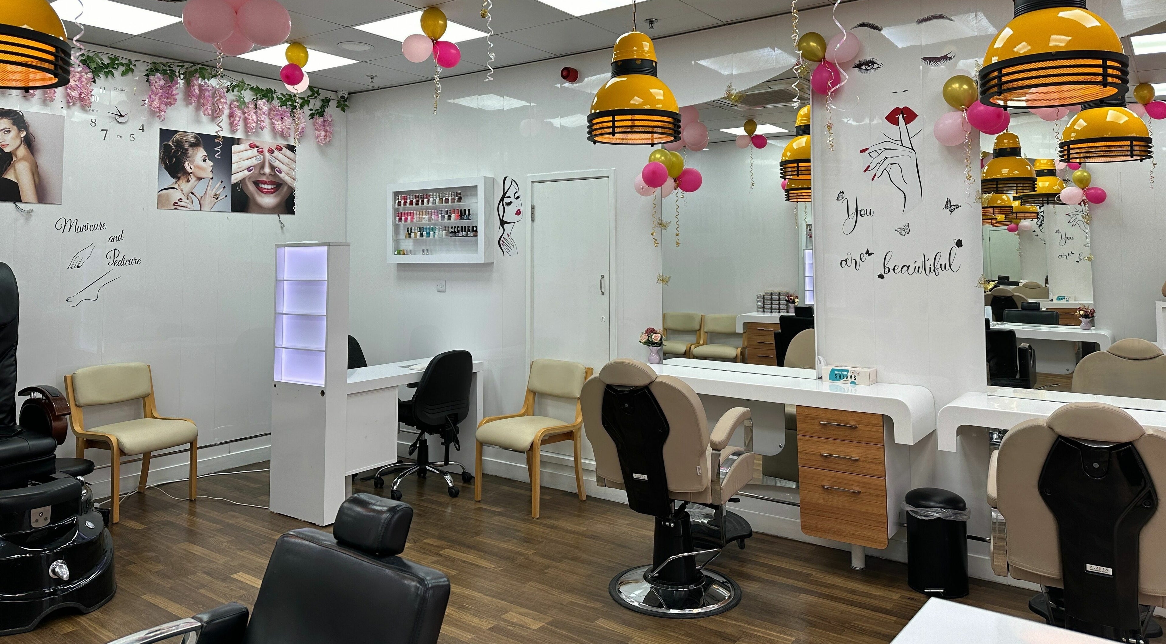 Modern salon interior at Beauty By Jaz, Keighley, England. Stylish decor with beauty stations and vibrant lighting.