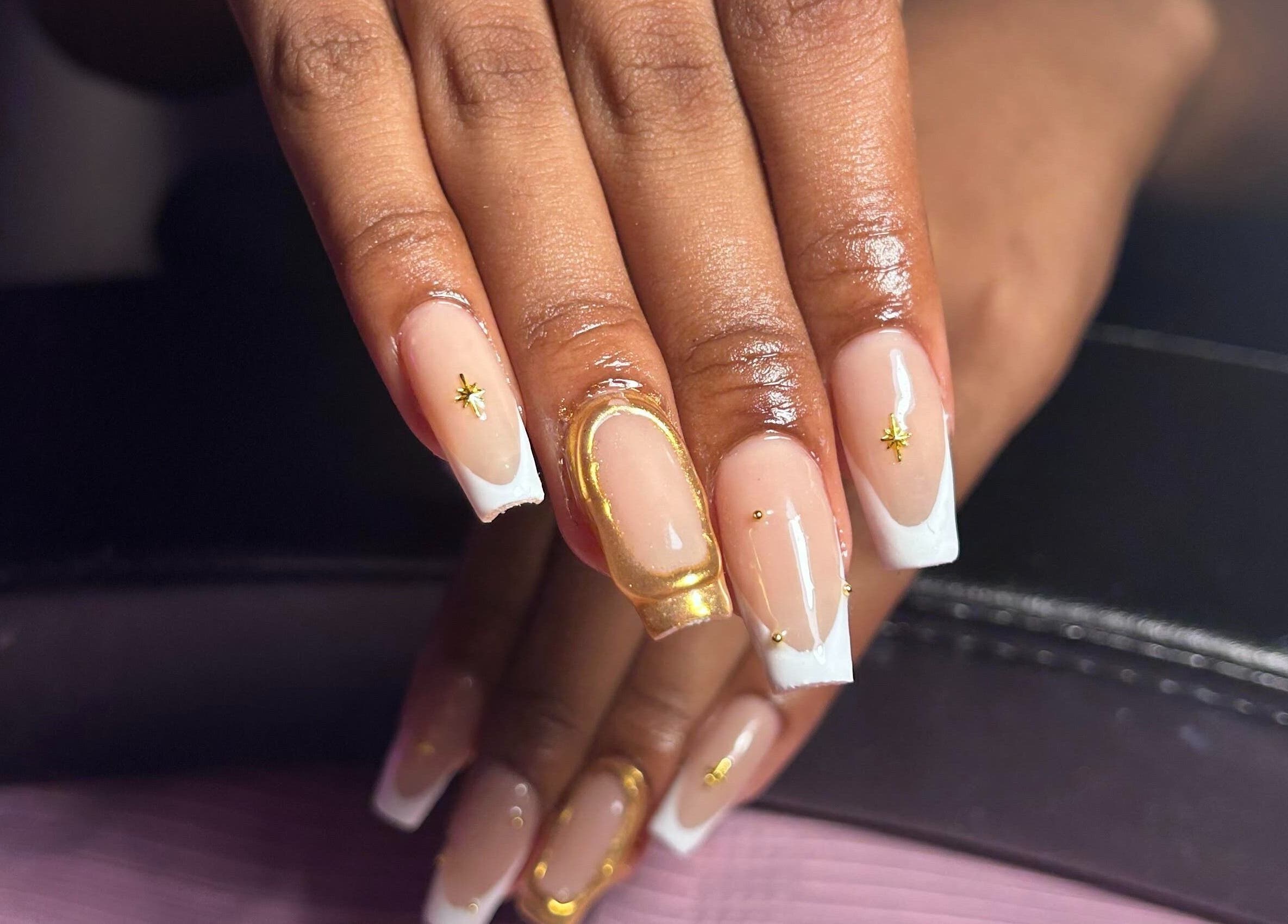 Elegant gold-accented nails at Nailzbyshaeimani, Kingston, St. Andrew Parish, JM, showcasing flawless style.