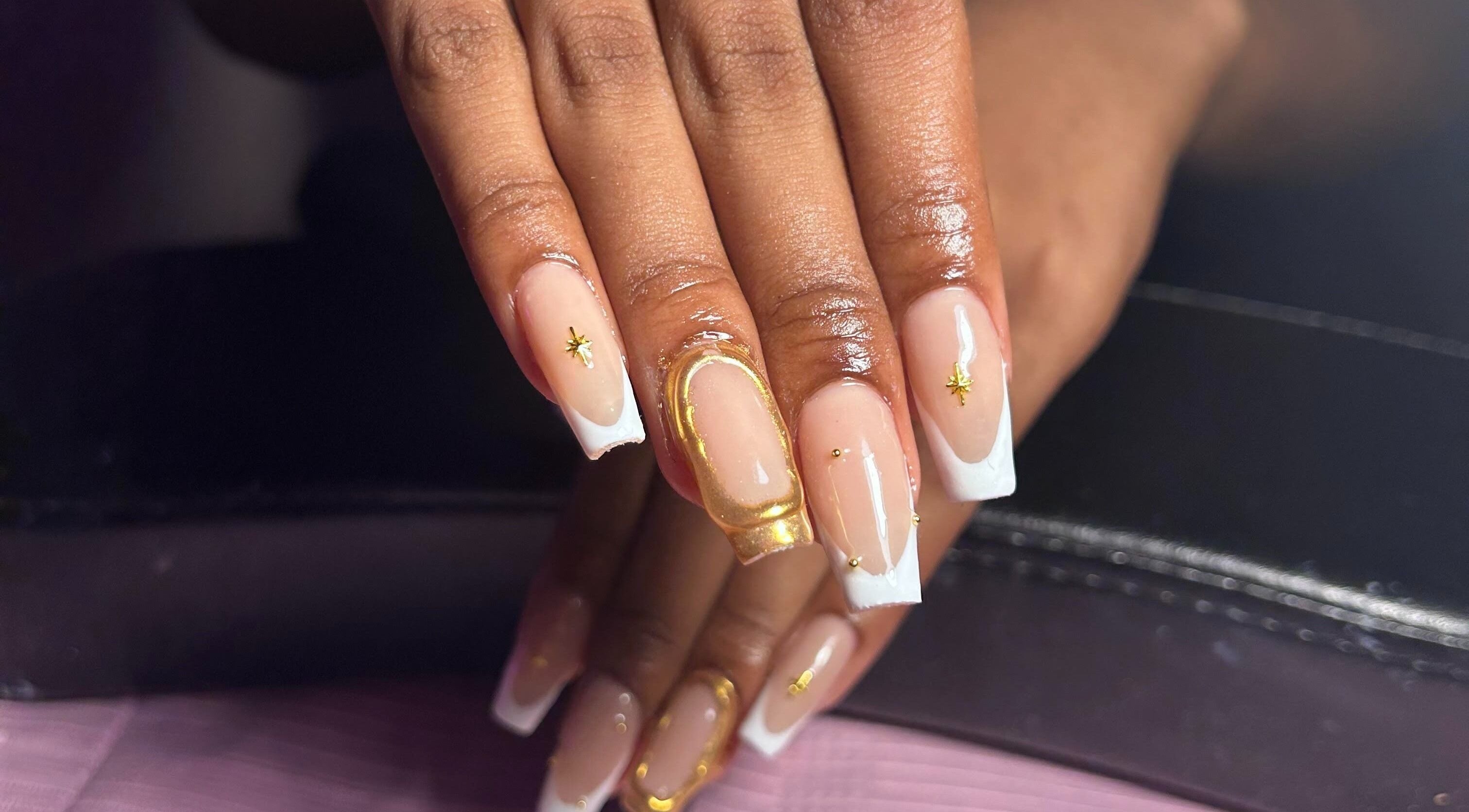 Elegant gold-accented nails at Nailzbyshaeimani, Kingston, St. Andrew Parish, JM, showcasing flawless style.