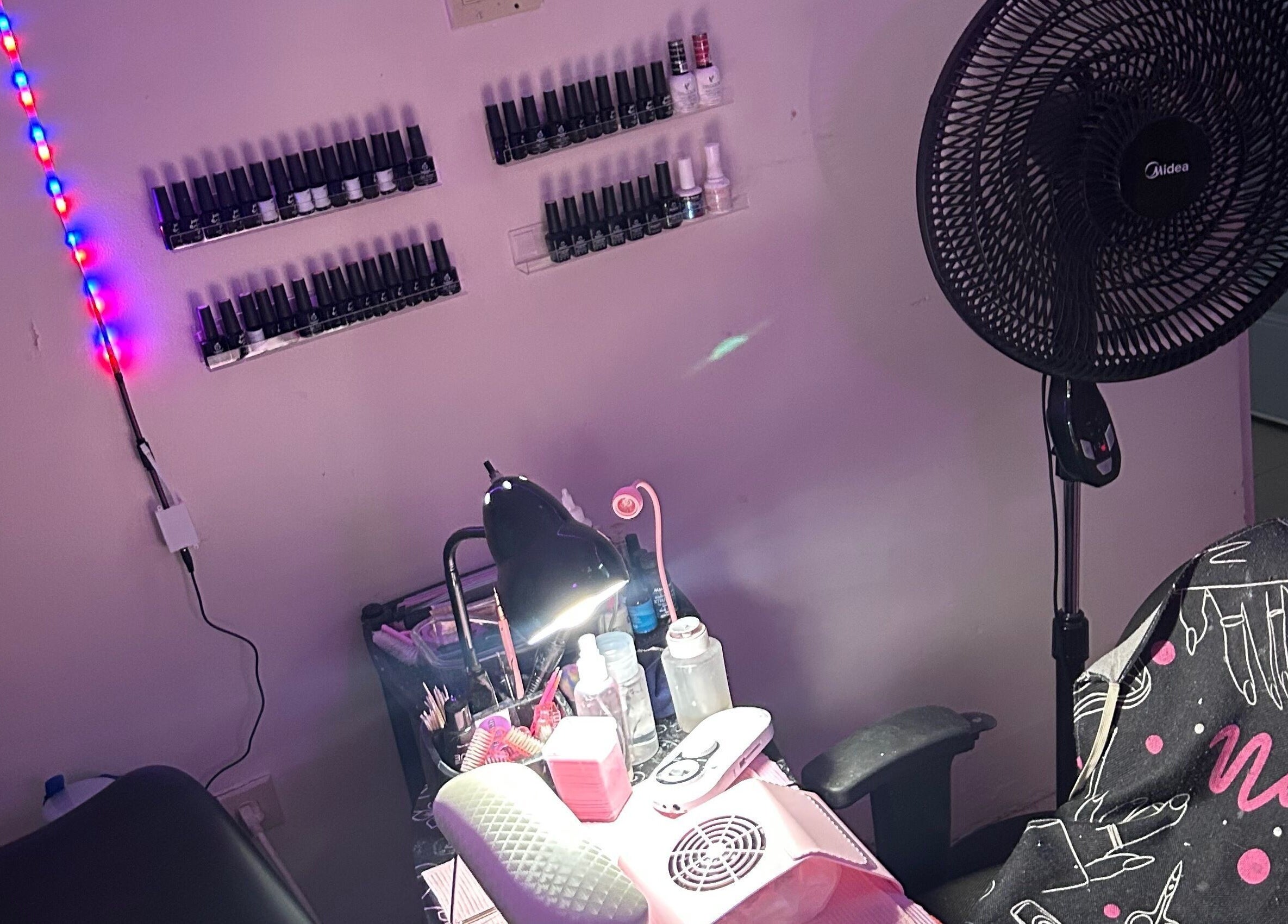 Nailzbyshaeimani nail station in Kingston, St. Andrew Parish, JM with vibrant lighting and polish collection.