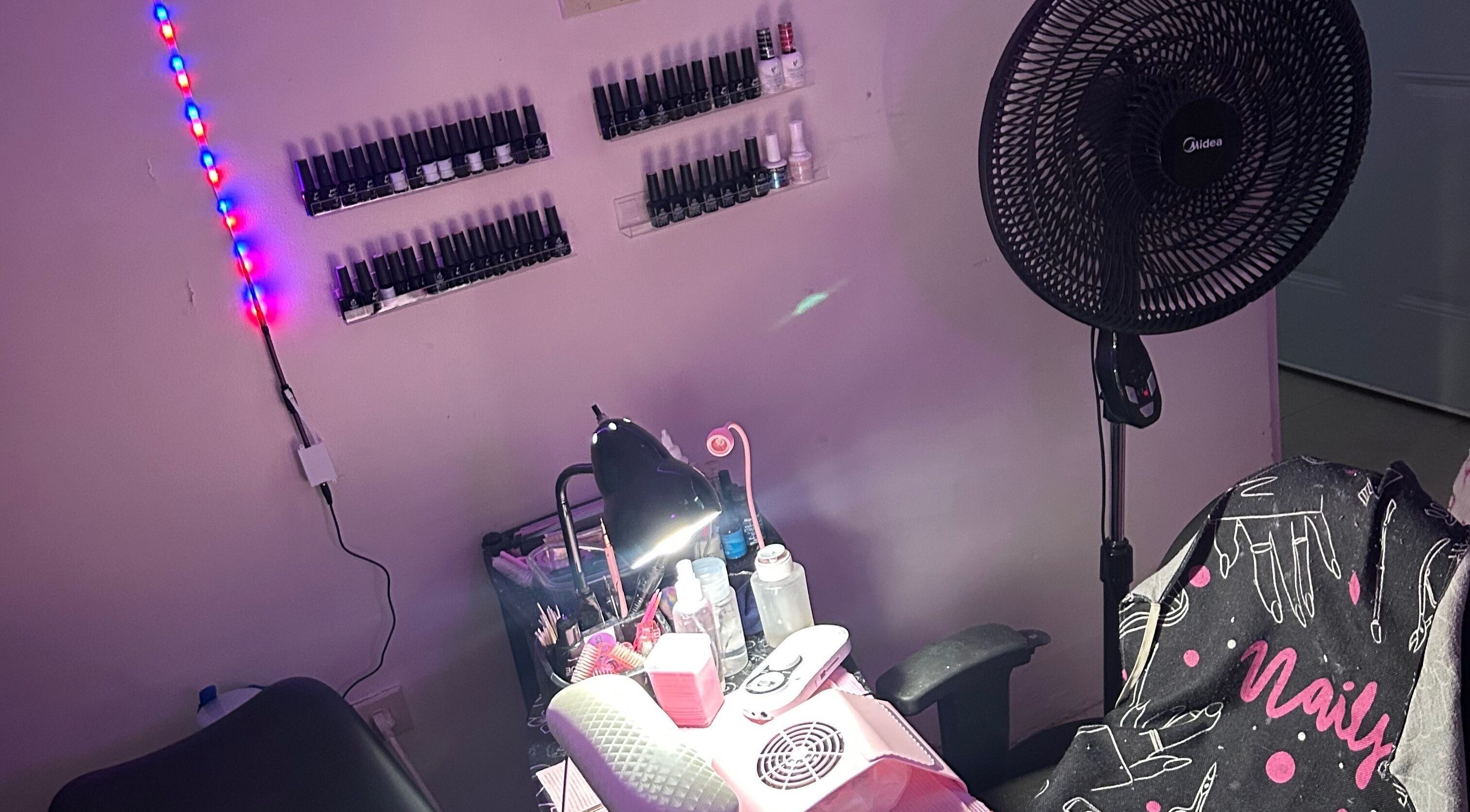 Nailzbyshaeimani nail station in Kingston, St. Andrew Parish, JM with vibrant lighting and polish collection.