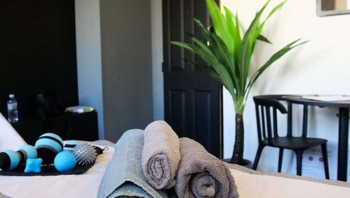 Relaxing therapy room at Active plus therapy by saule in Glasgow, Scotland, GB, featuring towels and massage tools.