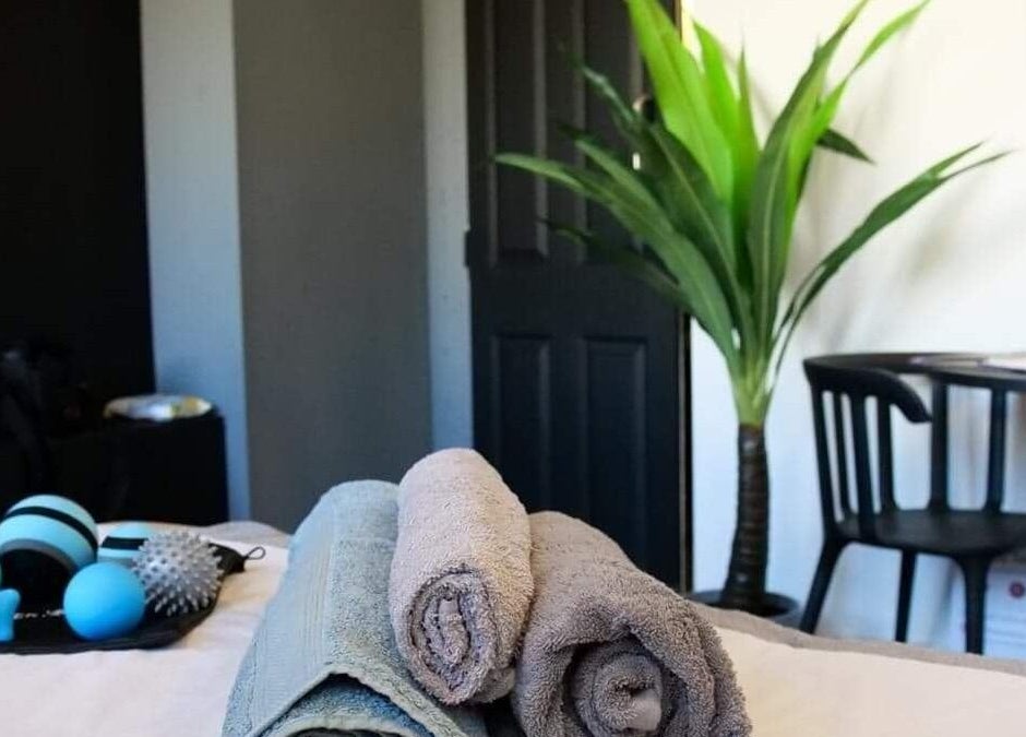 Relaxing therapy room at Active plus therapy by saule in Glasgow, Scotland, GB, featuring towels and massage tools.