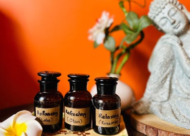 Aromatherapy bottles and Buddha statue at Tê Spa, Đà Nẵng, Đà Nẵng, VN create a calming ambiance.