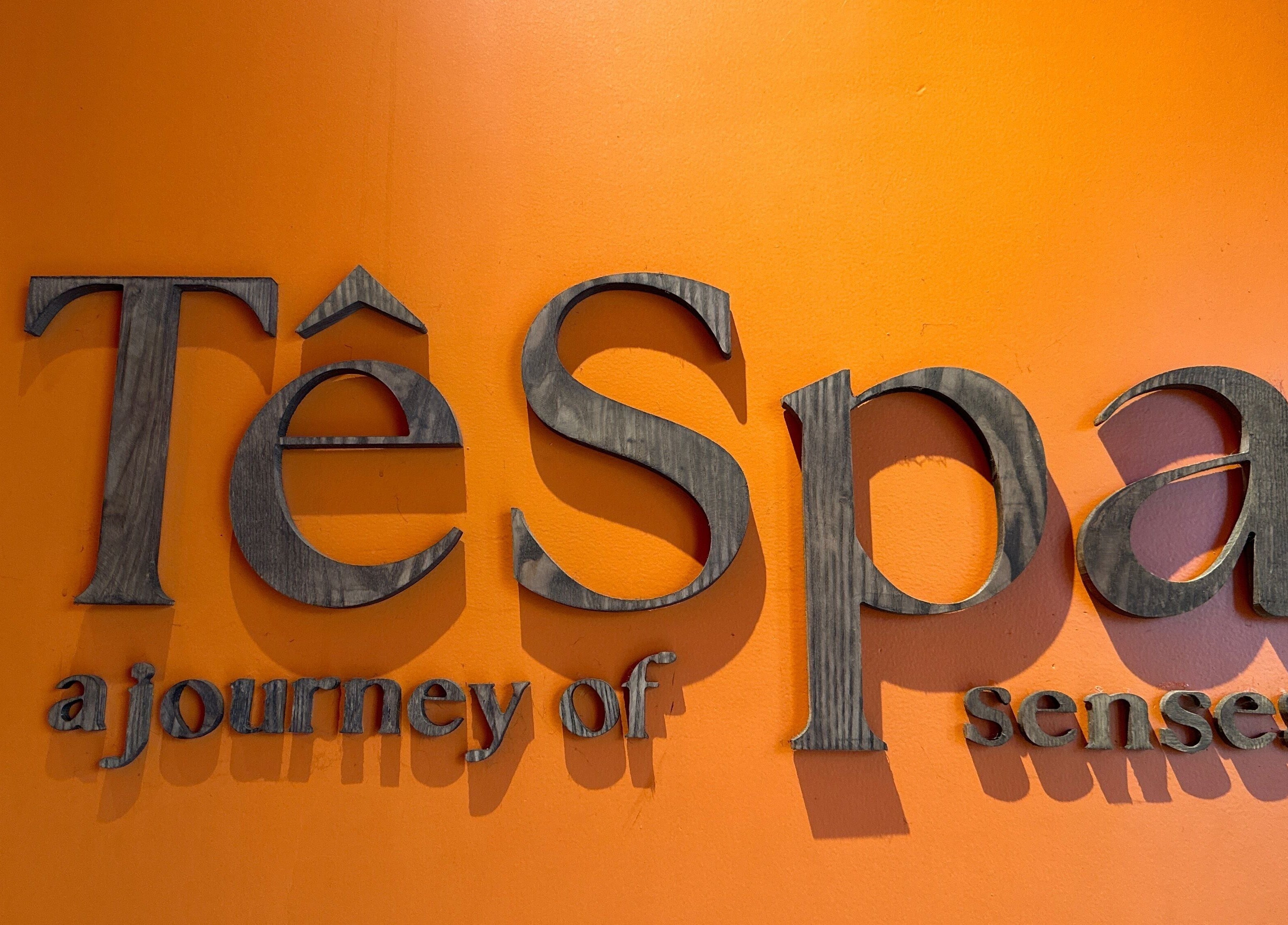 Wooden Tê Spa sign with orange background in Đà Nẵng, Đà Nẵng, VN.