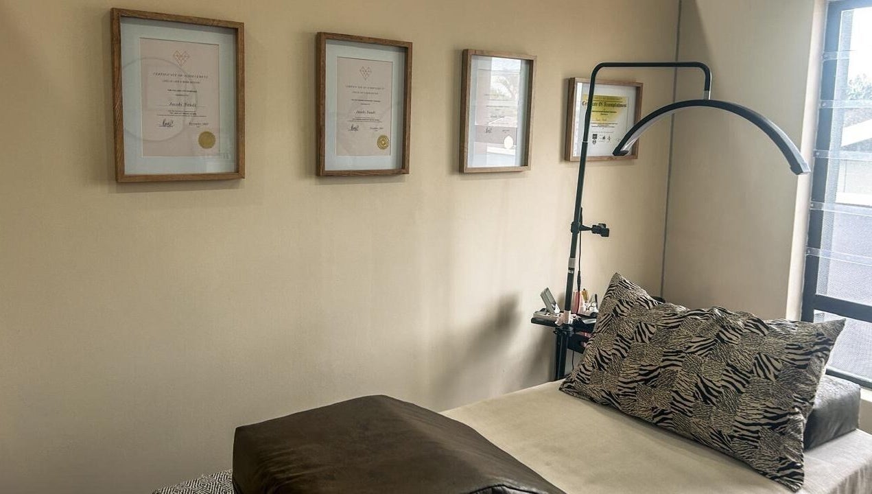 Cozy therapy room at Miaco by Cobi Naudé in Durban North, Kwazulu-natal, ZA with elegant decor and certificates.