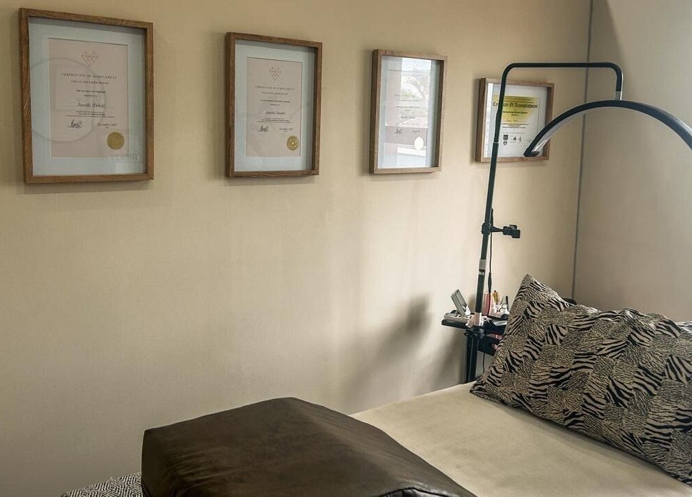 Cozy therapy room at Miaco by Cobi Naudé in Durban North, Kwazulu-natal, ZA with elegant decor and certificates.