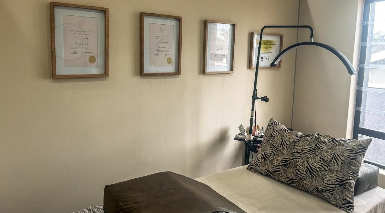 Cozy therapy room at Miaco by Cobi Naudé in Durban North, Kwazulu-natal, ZA with elegant decor and certificates.