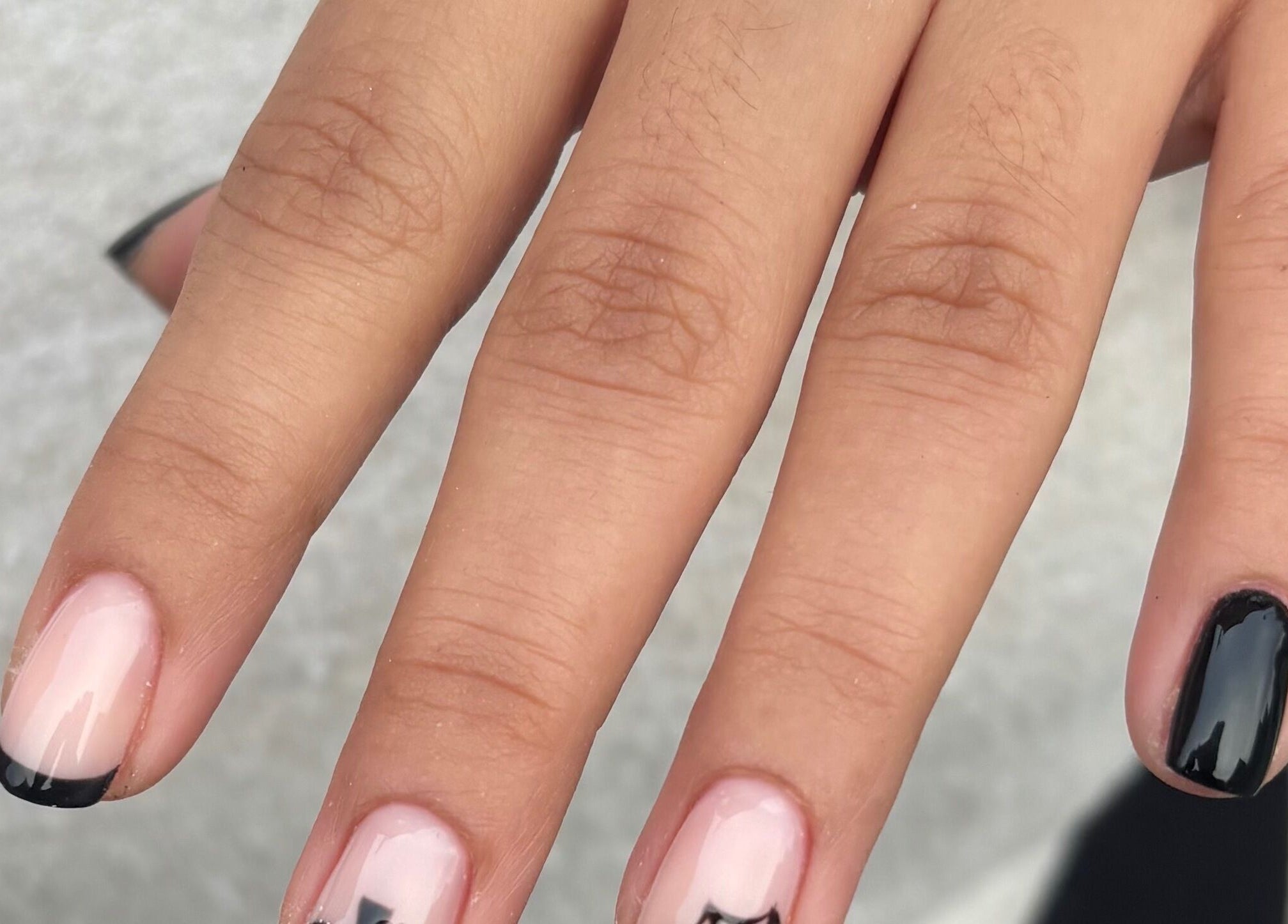 Stylish black and pink nail art at Gnb Nail Studio, Broomfield, England, GB.