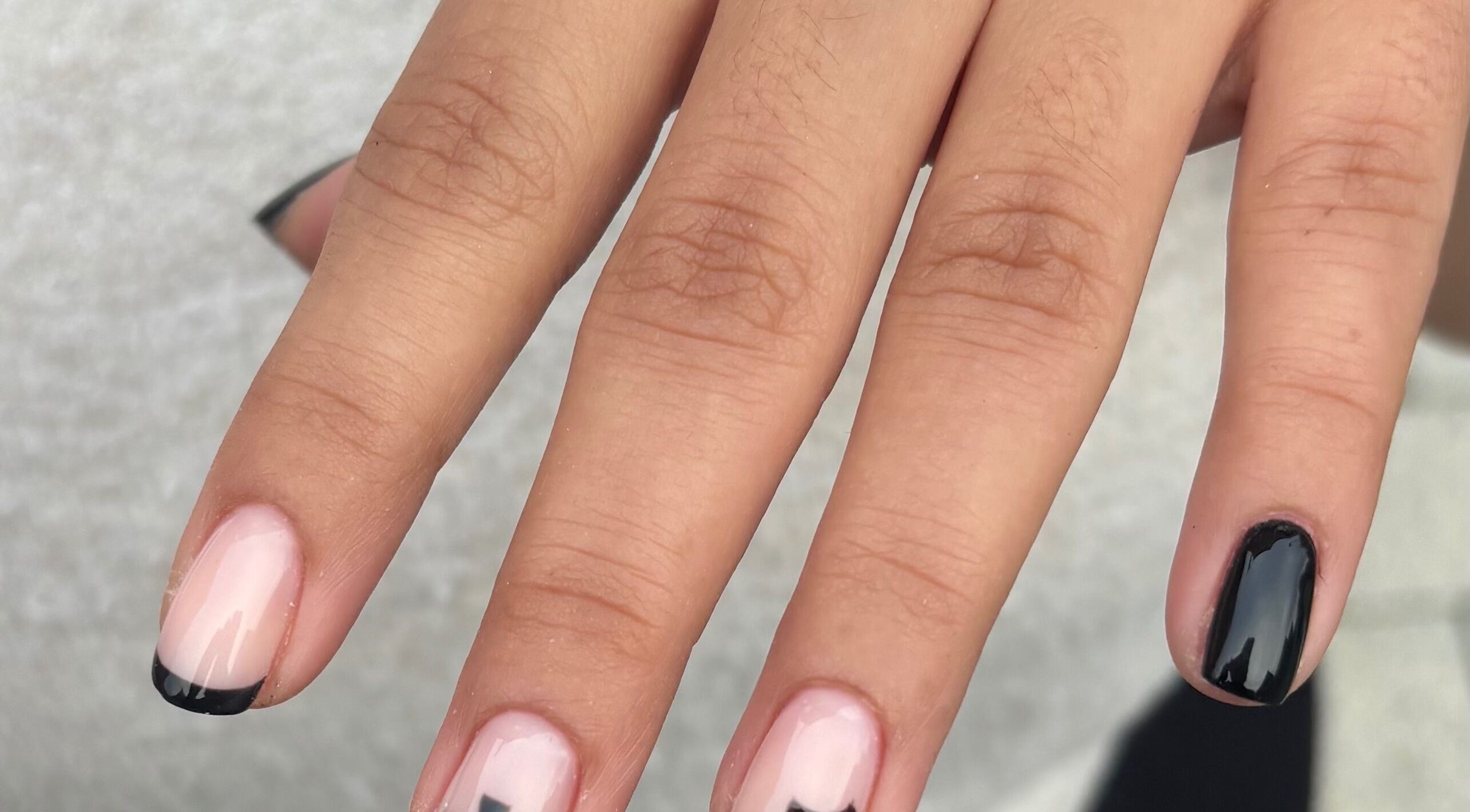 Stylish black and pink nail art at Gnb Nail Studio, Broomfield, England, GB.