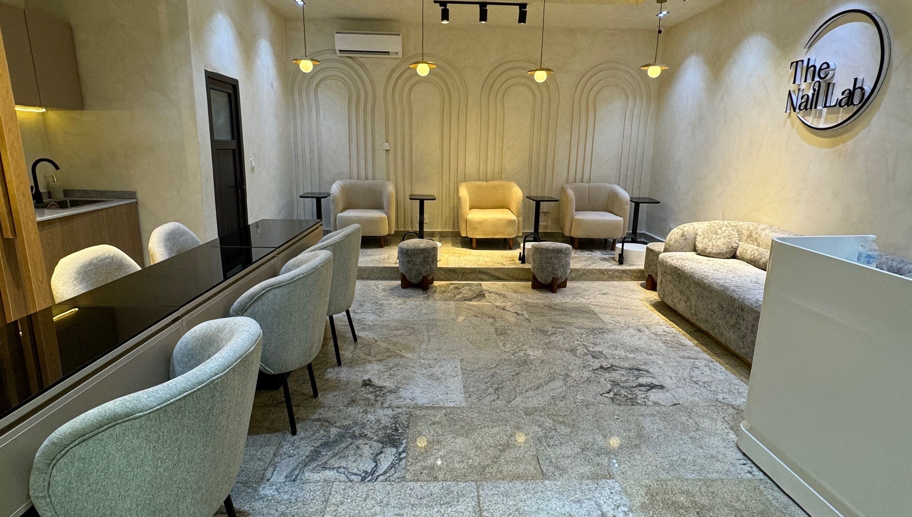 Sophisticated interior of The Nail Lab in Abuja, Federal Capital Territory, NG, featuring plush seating.