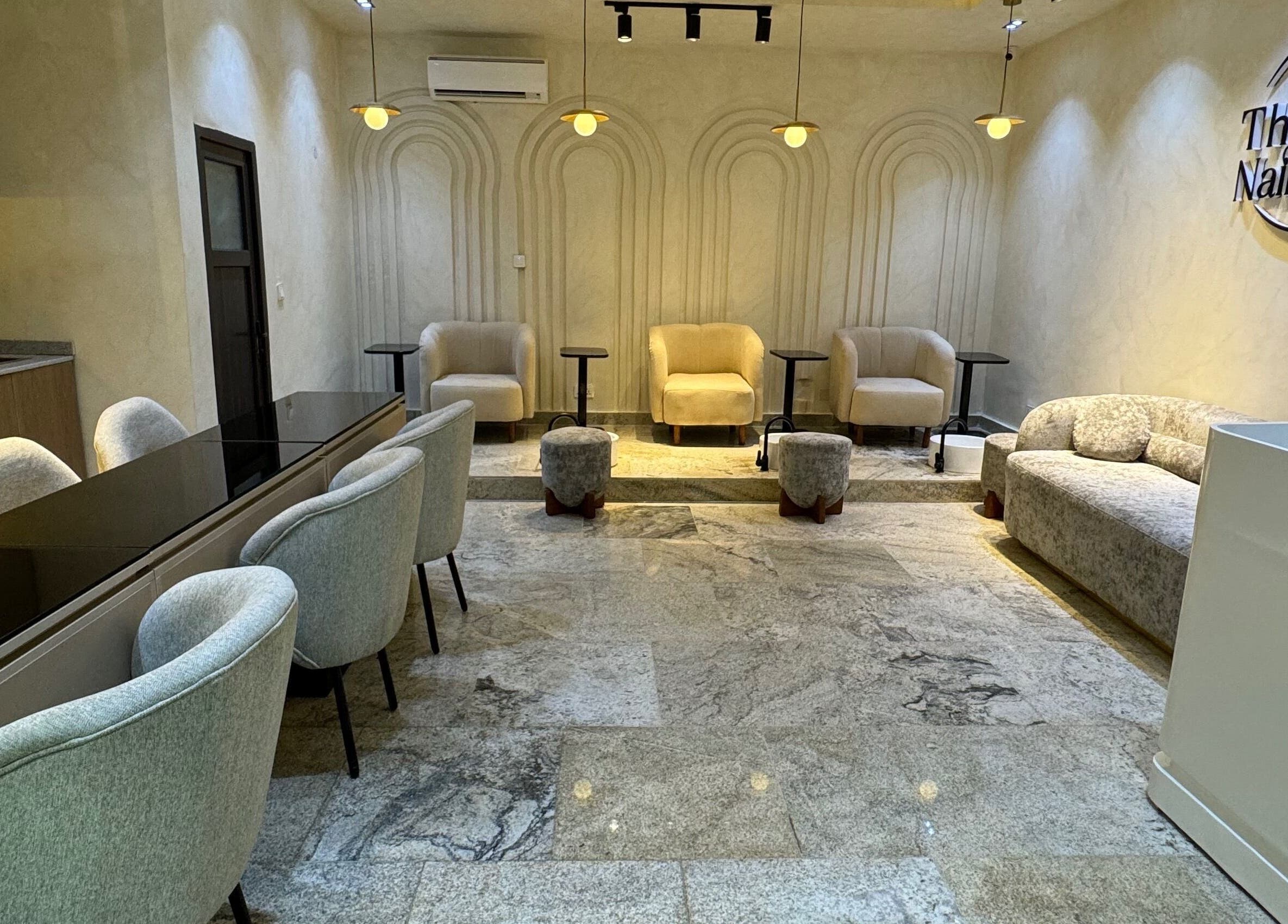 Sophisticated interior of The Nail Lab in Abuja, Federal Capital Territory, NG, featuring plush seating.