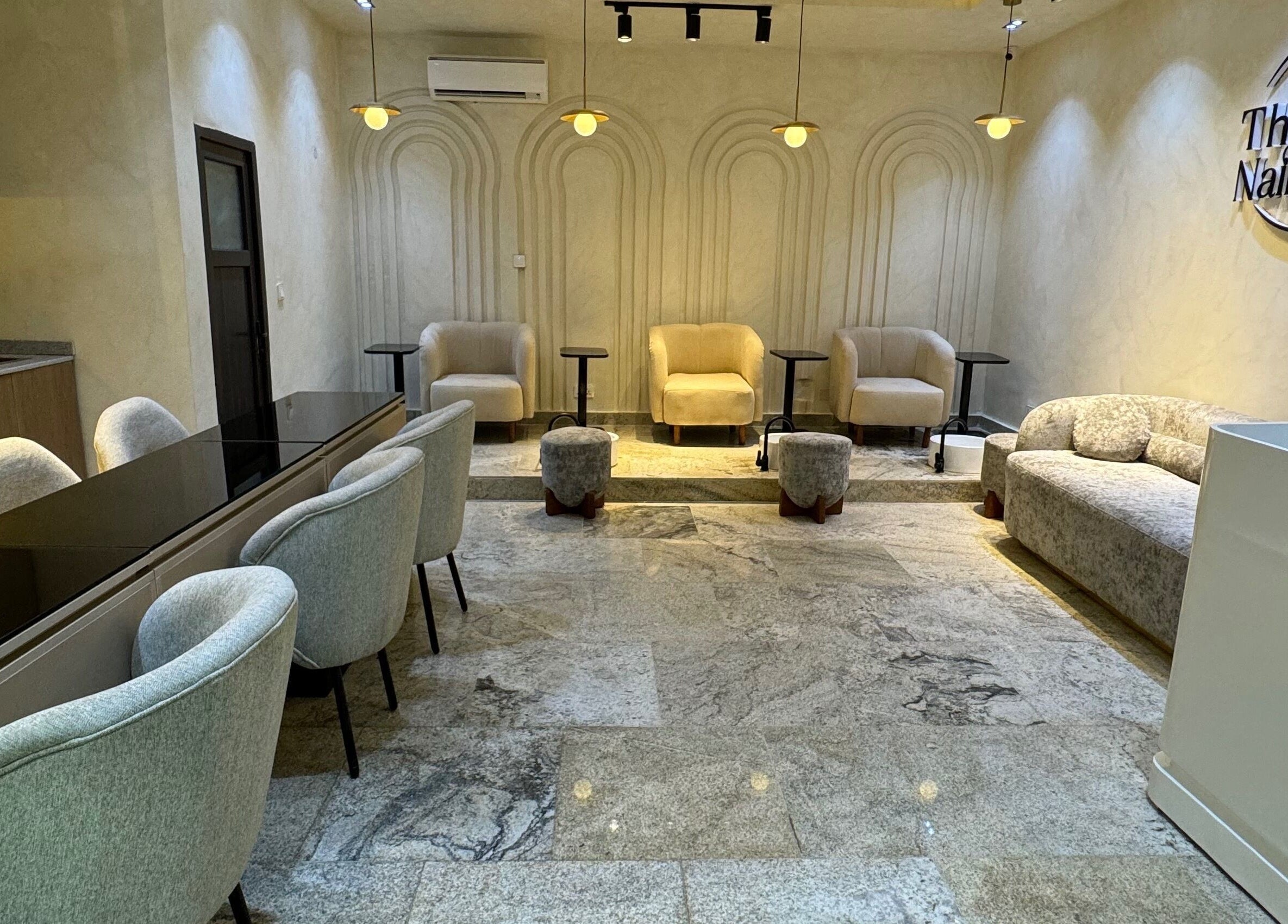 Sophisticated interior of The Nail Lab in Abuja, Federal Capital Territory, NG, featuring plush seating.