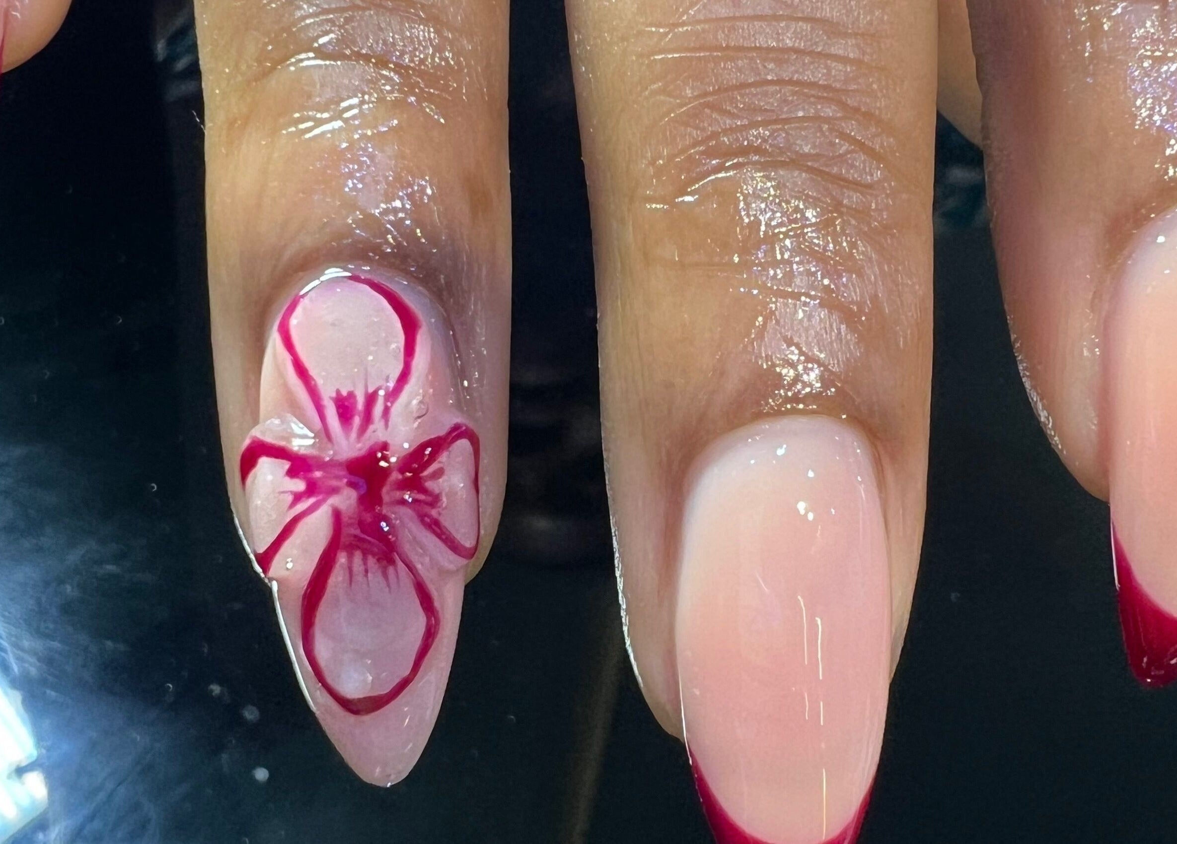 Elegant nail art featuring pink floral design at The Nail Lab in Abuja, Federal Capital Territory, NG.