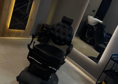Elegant styling chair at eleven barber studio in Varna, Varna, BG with modern mirror setup.