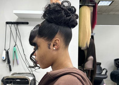 Elegant updo hairstyle at Freeman Beauty Palace, Johannesburg, Gauteng, ZA highlighting professional styling.