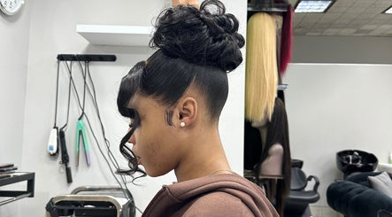 Elegant updo hairstyle at Freeman Beauty Palace, Johannesburg, Gauteng, ZA highlighting professional styling.