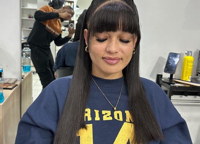 Client with sleek hairstyle at Freeman Beauty Palace, Johannesburg, Gauteng, ZA, showcasing expert beauty services.