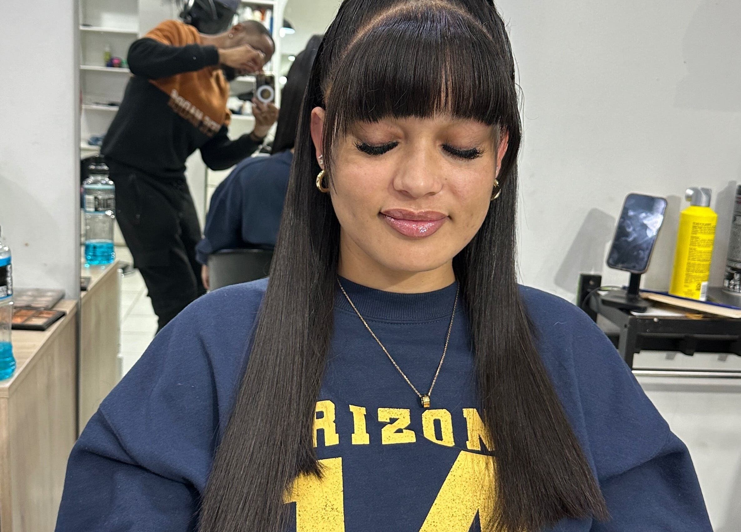 Client with sleek hairstyle at Freeman Beauty Palace, Johannesburg, Gauteng, ZA, showcasing expert beauty services.