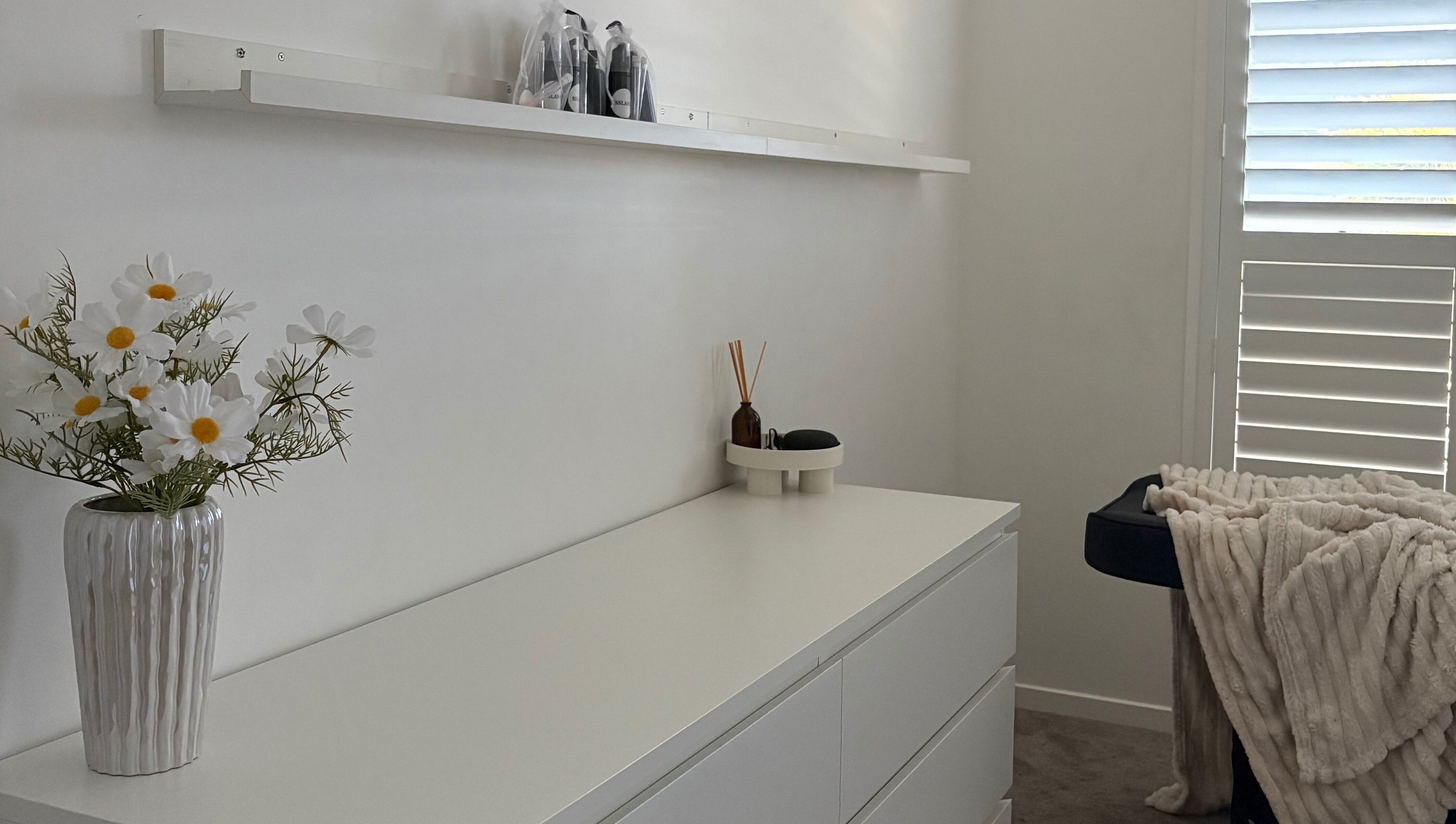 Tranquil treatment room at SSLASH in Caloundra West, Queensland, AU with soft lighting and calming decor.