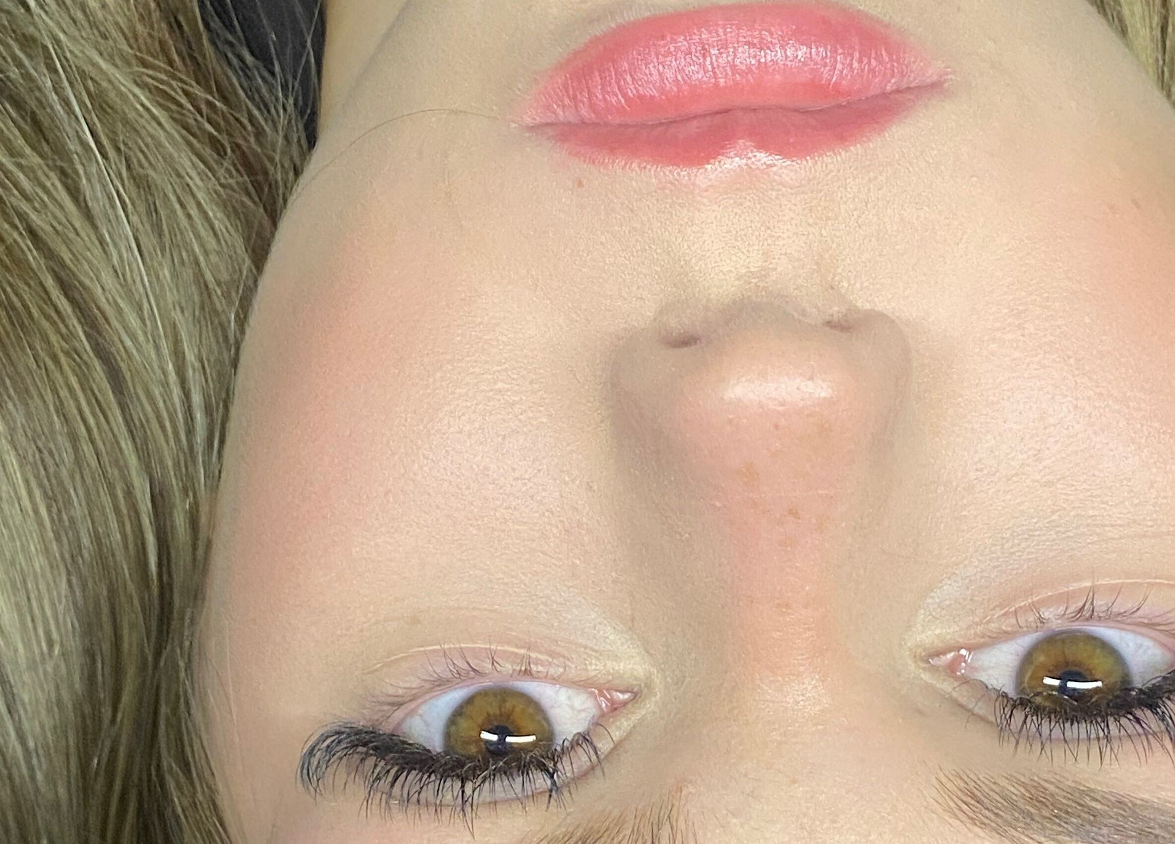 Close-up of a person with glowing skin, showcasing beauty services at SSLASH, Caloundra West, Queensland, AU.