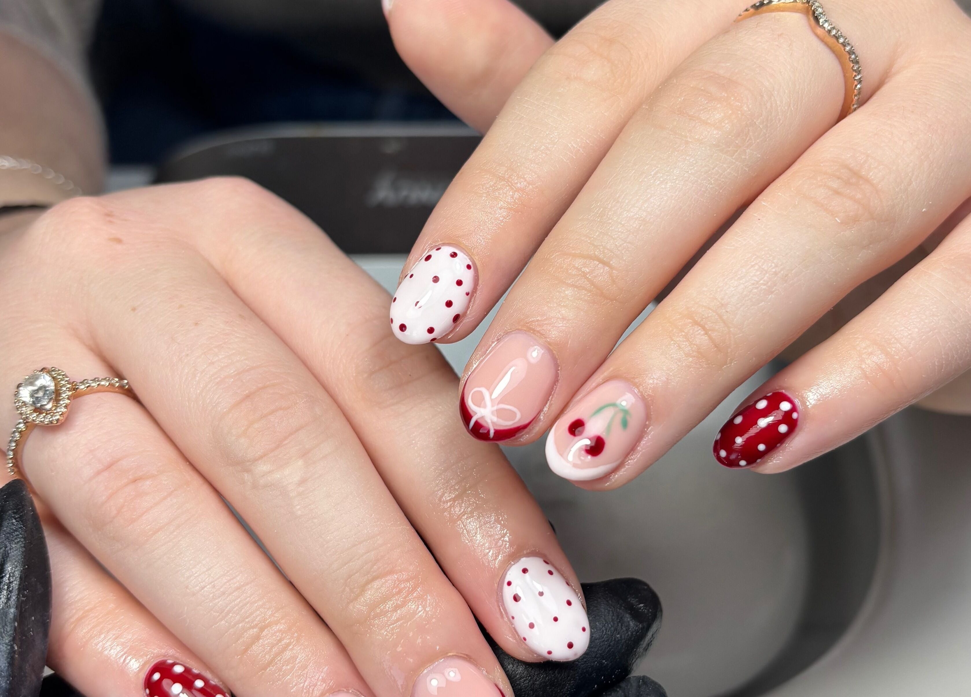 Cherry-themed nail art at By Lucy Ellenx, Stratford-upon-Avon, England, GB, showcasing intricate designs.