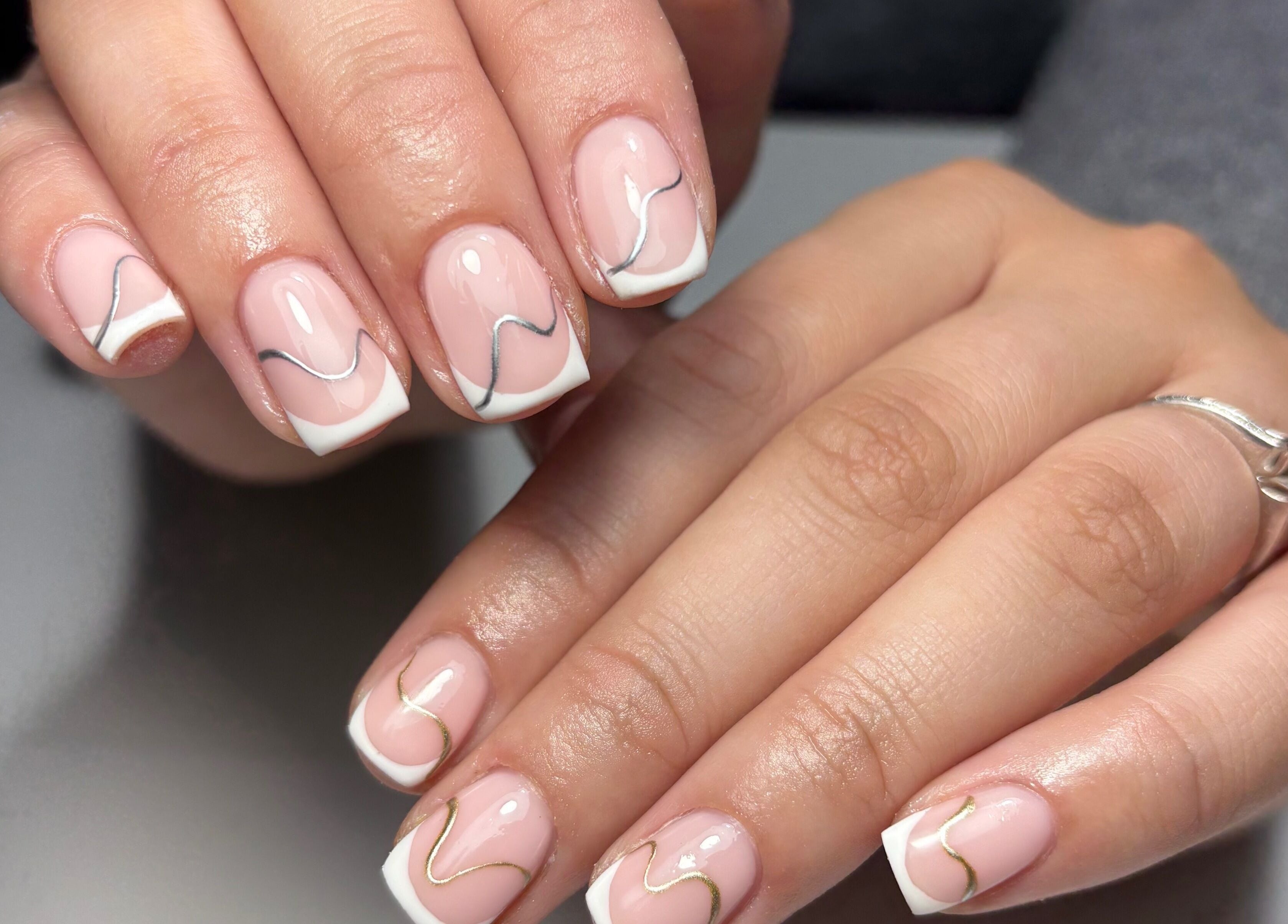 Elegant nail art with silver lines by Lucy Ellenx, Stratford-upon-Avon, England, GB.