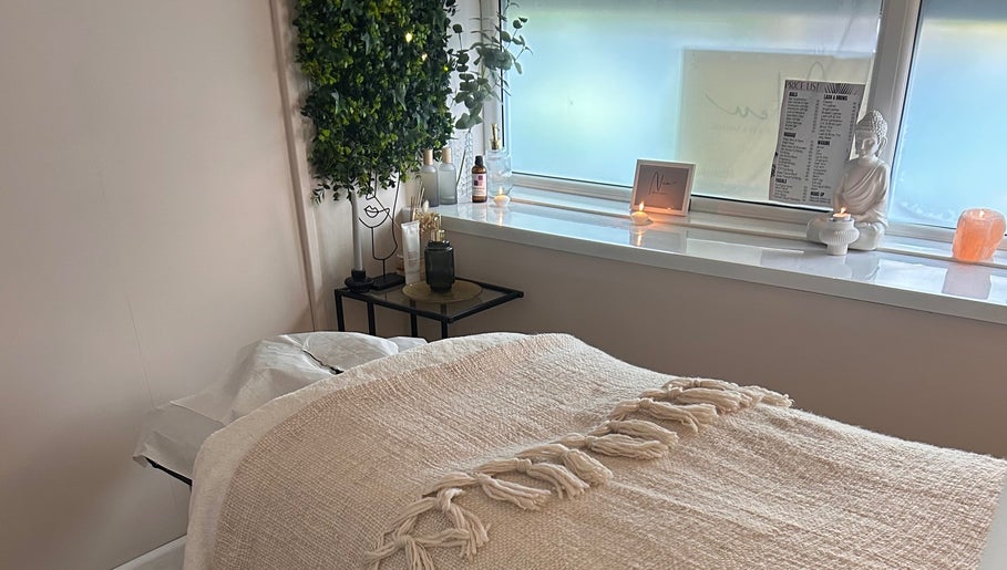 Relaxing spa room at Neu Beauty Salon, Newport, Wales, GB with cozy bed and serene decor.