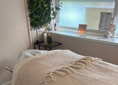 Relaxing spa room at Neu Beauty Salon, Newport, Wales, GB with cozy bed and serene decor.