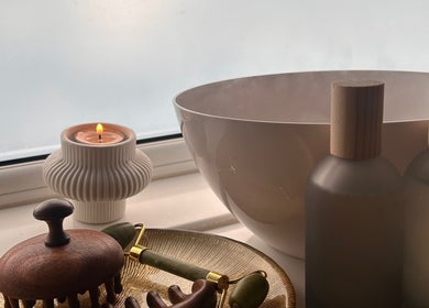 Relaxing spa setup at Neu Beauty Salon, Newport, Wales, GB featuring candle and wooden tools.