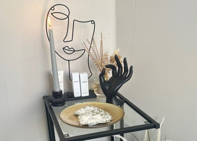 Stylish decor at Neu Beauty Salon in Newport, Wales, GB, featuring modern art and beauty products.