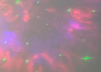Colorful galaxy-inspired ceiling design at Neu Beauty Salon, Newport, Wales, GB creates a relaxing ambiance.