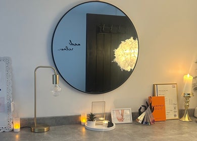 Elegant vanity setup with mirror and decor at Neu Beauty Salon, Newport, Wales, GB. Cozy and inviting ambiance.