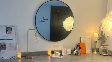 Elegant vanity setup with mirror and decor at Neu Beauty Salon, Newport, Wales, GB. Cozy and inviting ambiance.