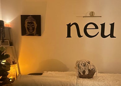 Calm room at Neu Beauty Salon, Newport, Wales, GB with warm lighting and serene decor.