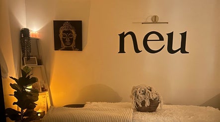 Calm room at Neu Beauty Salon, Newport, Wales, GB with warm lighting and serene decor.