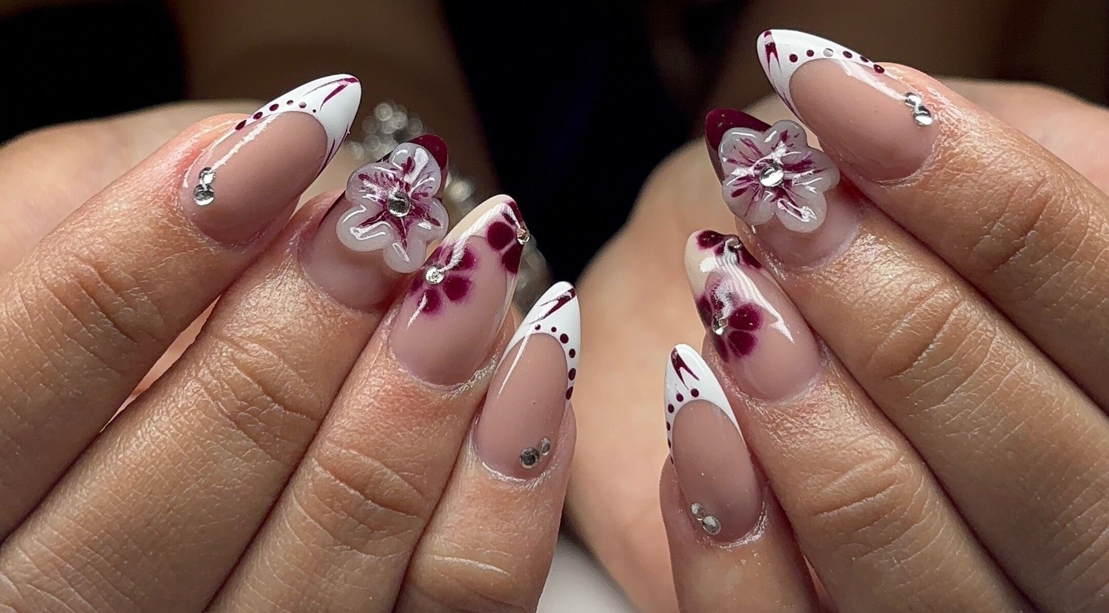 Nail art with flowers at Becks Beauty, Kidsgrove, England, GB. Intricate design and elegant style.