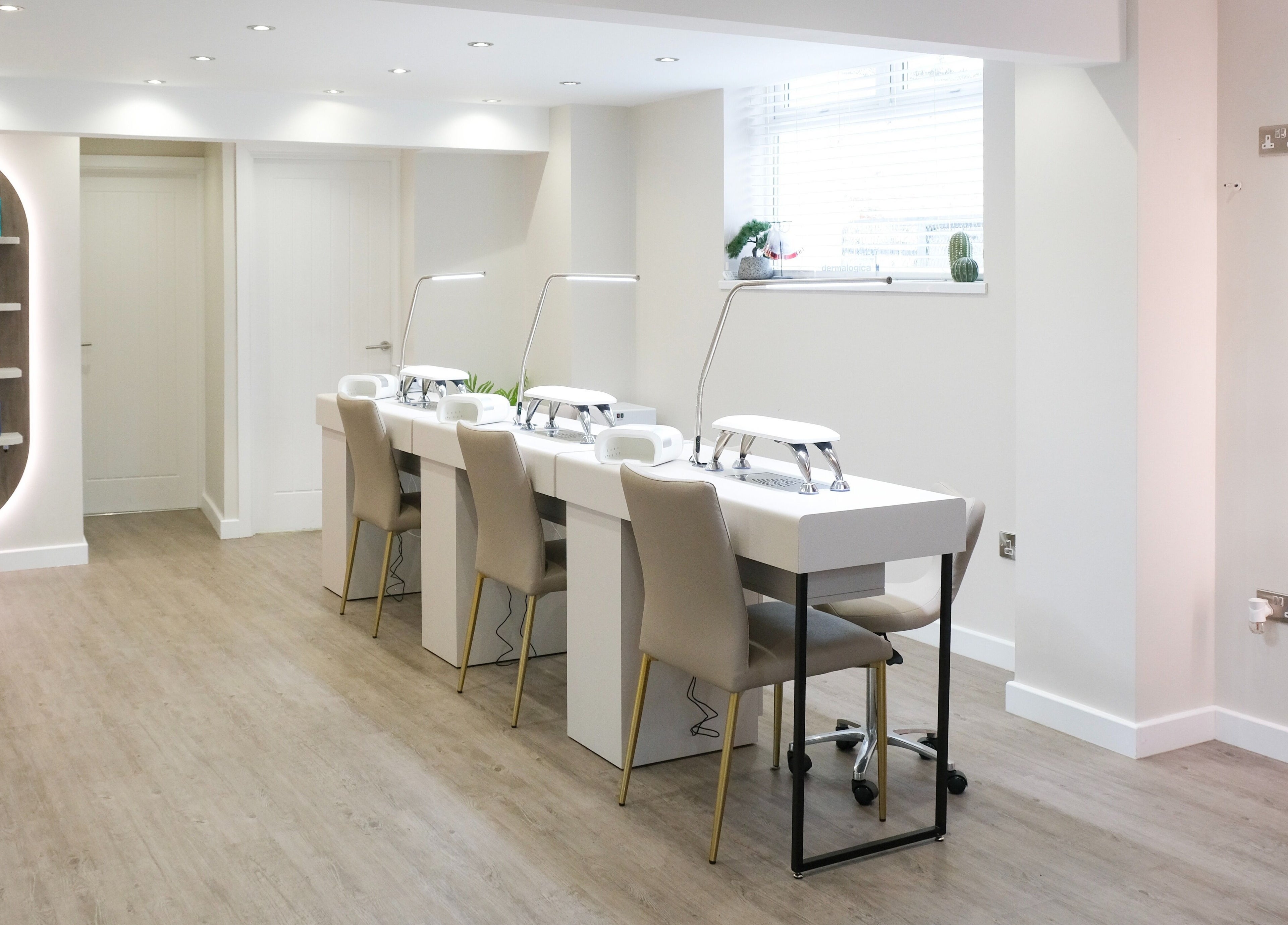 Elegant nail salon at Nova, Clitheroe, England, GB featuring modern nail stations and chic decor.
