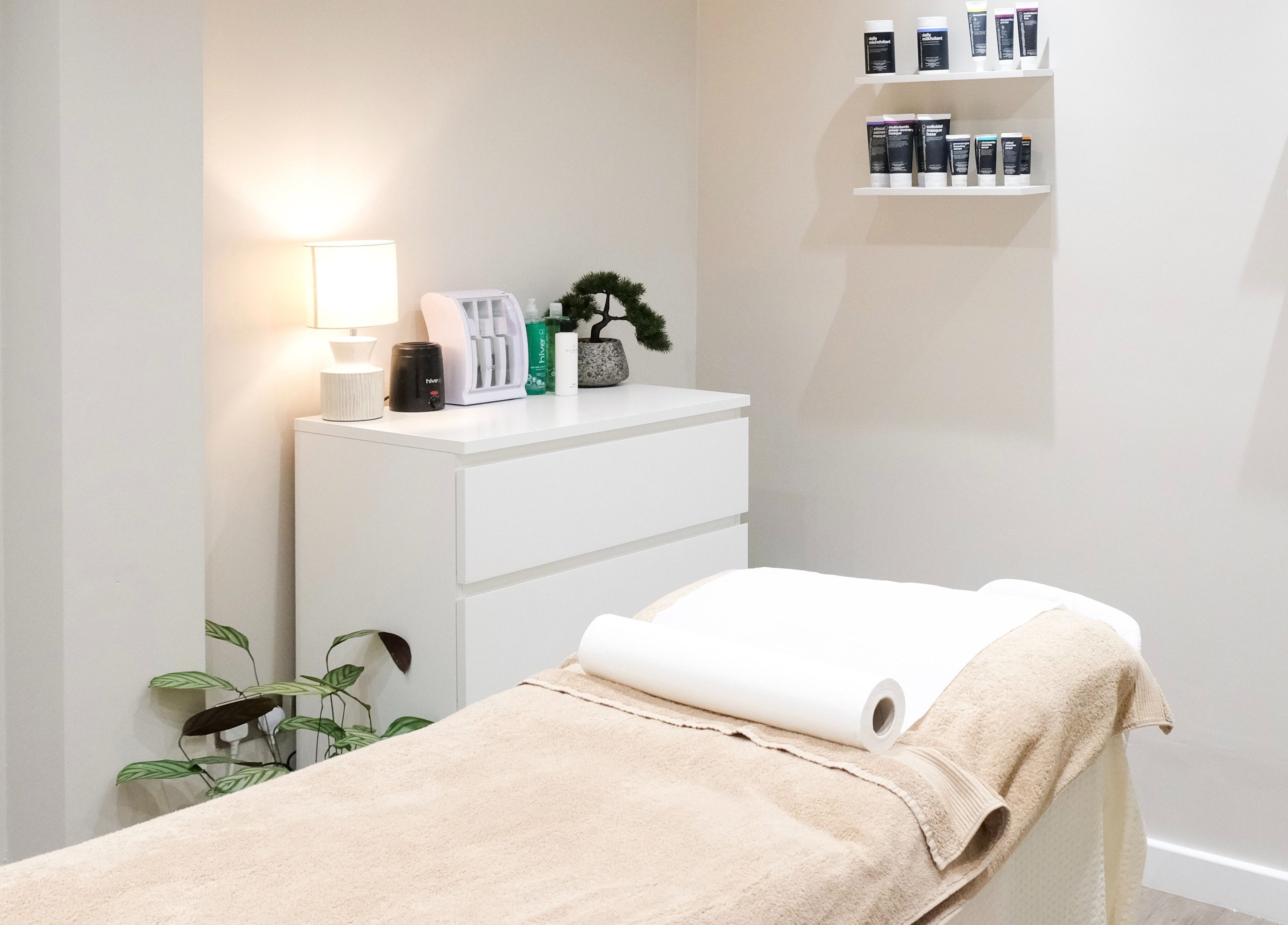Tranquil treatment room at Nova, Clitheroe, England, GB with a cozy massage table and soothing decor.