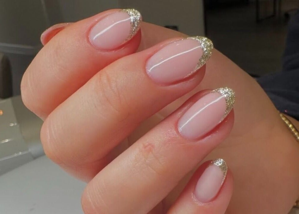 Elegant nails with gold tips at Nova, Clitheroe, England, GB. Perfect manicure for stylish looks.