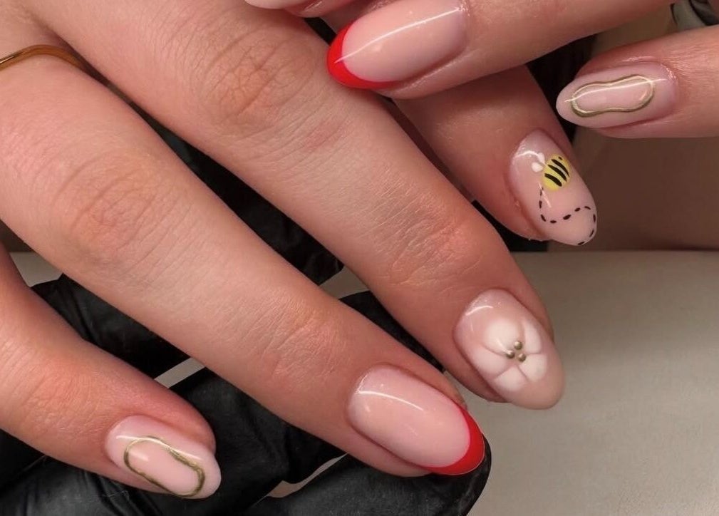 Stylish nail art at Nova, Clitheroe, England, GB featuring intricate designs and vibrant colors.