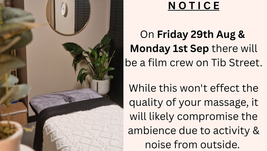 Peaceful massage room at Bee Revived, Manchester, England, GB with a notice about filming activity.